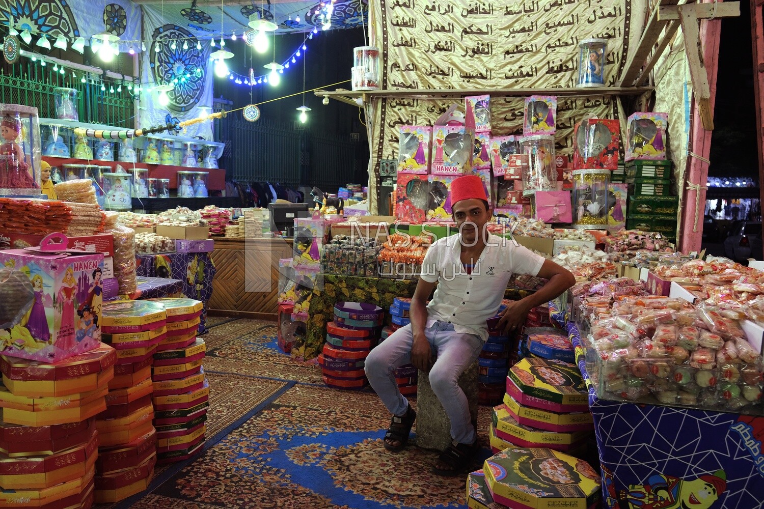 Man standing selling the candies of the prophet Muhammad&#39;s birth in the street