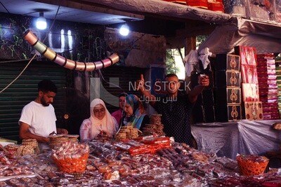 View of a People in the street buying the candies of the prophet Muhammad&#39;s birth