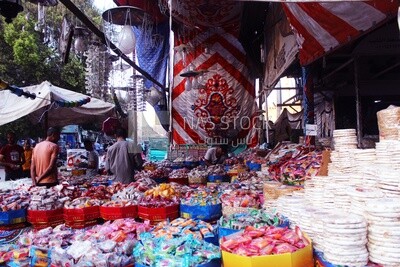 View of Collection of Arabian Sweet Candies with Nuts, Peanuts, Hazelnuts, and Pistachios in the Street, Egyptian Desserts of Prophet Muhammad&#39;s Birth Celebration