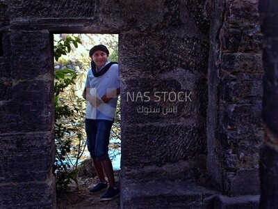 European tourist stands at the door of a temple , Egypt