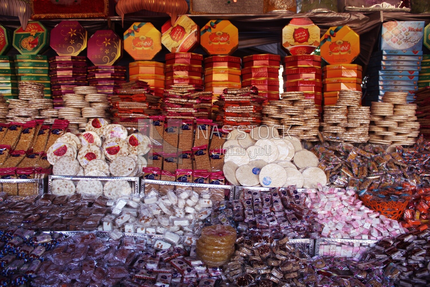 View of Collection of Arabian Sweet Candies with Nuts, Peanuts, Hazelnuts, and Pistachios in the Street, Egyptian Desserts of Prophet Muhammad&#39;s Birth Celebration