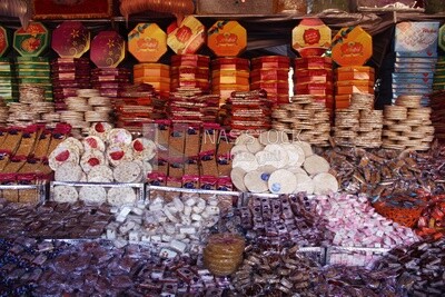 View of Collection of Arabian Sweet Candies with Nuts, Peanuts, Hazelnuts, and Pistachios in the Street, Egyptian Desserts of Prophet Muhammad&#39;s Birth Celebration