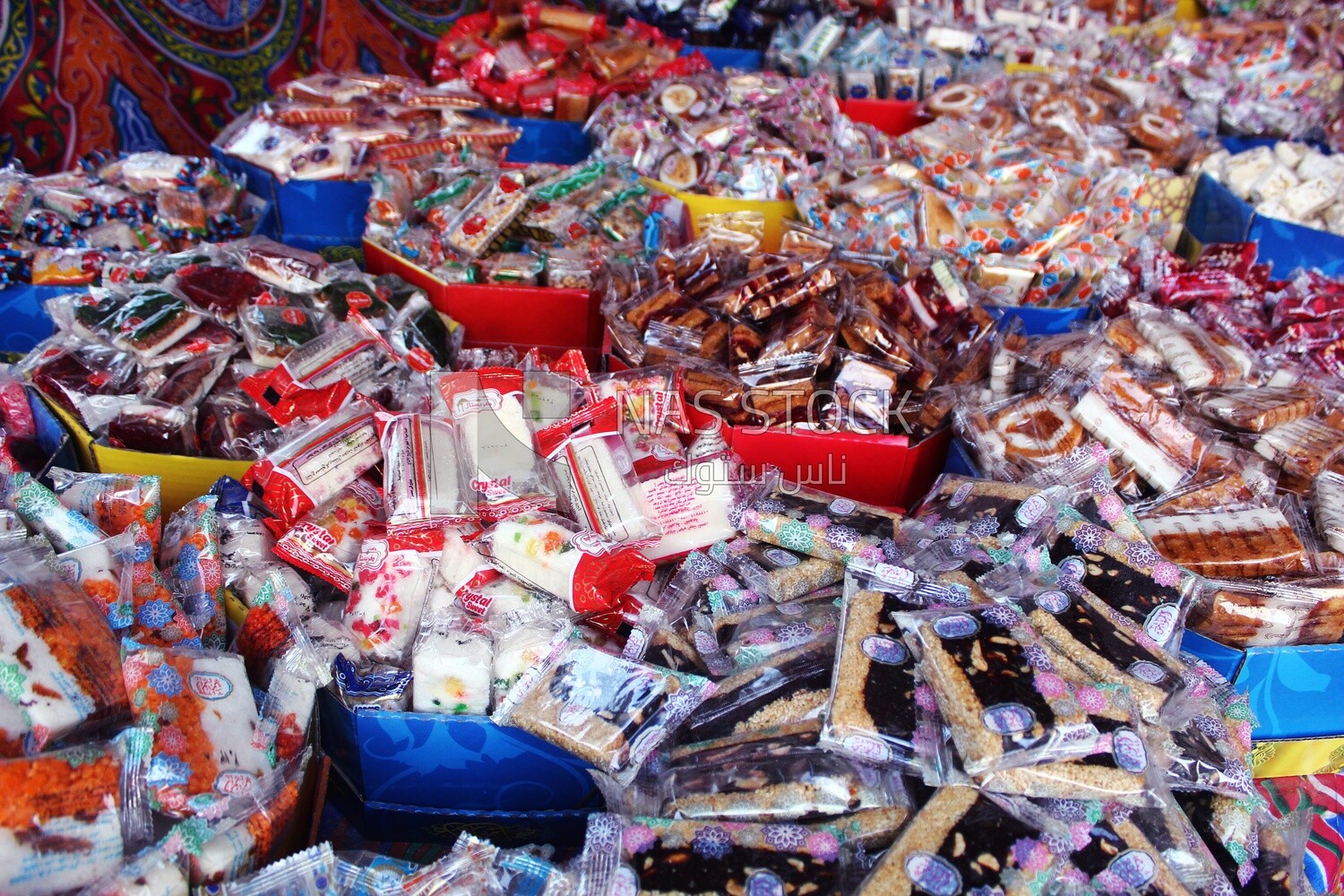 View of Collection of Arabian Sweet Candies with Nuts, Peanuts, Hazelnuts, and Pistachios in the Street, Egyptian Desserts of Prophet Muhammad&#39;s Birth Celebration