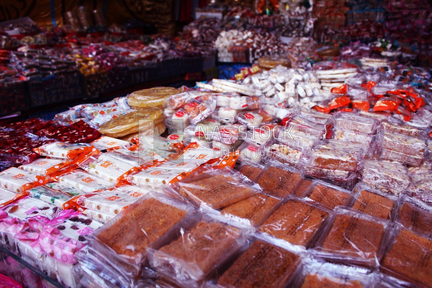 View of Collection of Arabian Sweet Candies with Nuts, Peanuts, Hazelnuts, and Pistachios in the Street, Egyptian Desserts of Prophet Muhammad&#39;s Birth Celebration