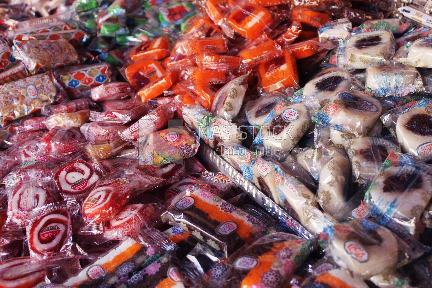 View of Collection of Arabian Sweet Candies with Nuts, Peanuts, Hazelnuts, and Pistachios in the Street, Egyptian Desserts of Prophet Muhammad&#39;s Birth Celebration
