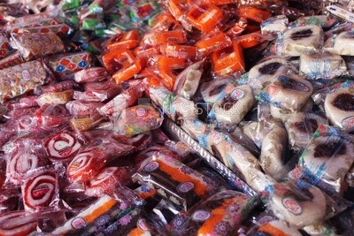 View of Collection of Arabian Sweet Candies with Nuts, Peanuts, Hazelnuts, and Pistachios in the Street, Egyptian Desserts of Prophet Muhammad&#39;s Birth Celebration