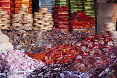 View of Collection of Arabian Sweet Candies with Nuts, Peanuts, Hazelnuts, and Pistachios in the Street, Egyptian Desserts of Prophet Muhammad&#39;s Birth Celebration