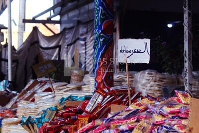 View of Collection of Arabian Sweet Candies with Nuts, Peanuts, Hazelnuts, and Pistachios in the Street, Egyptian Desserts of Prophet Muhammad&#39;s Birth Celebration