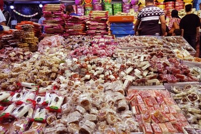 View of Collection of Arabian Sweet Candies with Nuts, Peanuts, Hazelnuts, and Pistachios in the Street, Egyptian Desserts of Prophet Muhammad&#39;s Birth Celebration