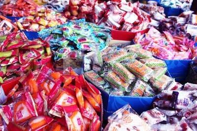 View of Collection of Arabian Sweet Candies with Nuts, Peanuts, Hazelnuts, and Pistachios in the Street, Egyptian Desserts of Prophet Muhammad&#39;s Birth Celebration