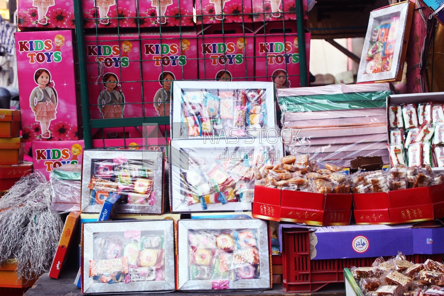 View of Collection of Arabian Sweet Candies with Nuts, Peanuts, Hazelnuts, and Pistachios in the Street, Egyptian Desserts of Prophet Muhammad&#39;s Birth Celebration