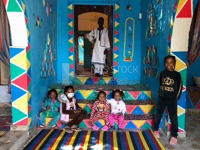 Nubian children inside a colorful Nubian house, Aswan, Egypt