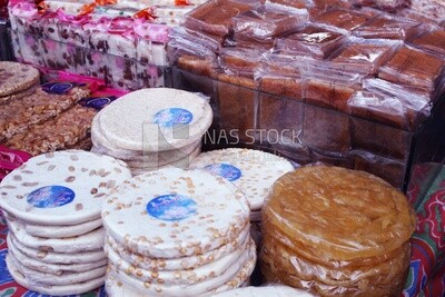 View of Collection of Arabian Sweet Candies with Nuts, Peanuts, Hazelnuts, and Pistachios in the Street, Egyptian Desserts of Prophet Muhammad&#39;s Birth Celebration