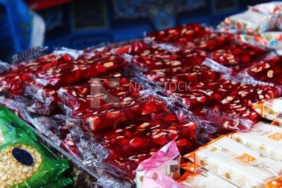 View of Collection of Arabian Sweet Candies with Nuts, Peanuts, Hazelnuts, and Pistachios in the Street, Egyptian Desserts of Prophet Muhammad&#39;s Birth Celebration