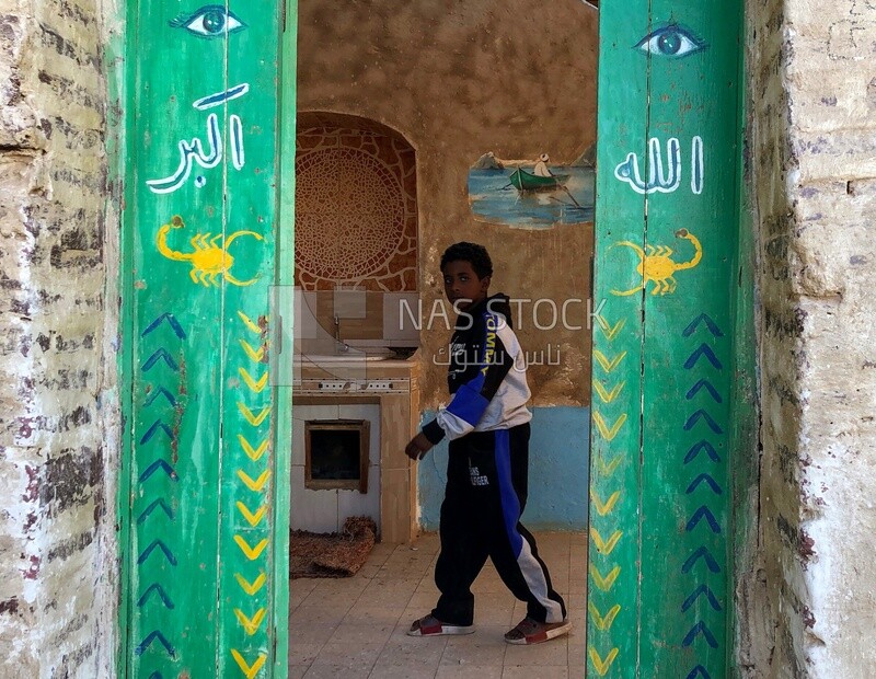 Door shot of a Nubian boy, Aswan, Egypt