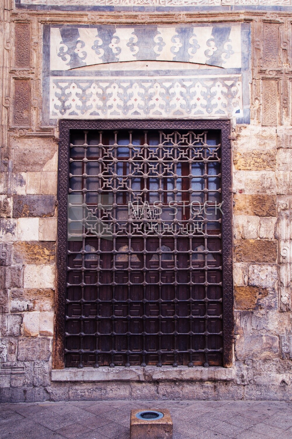 Wooden grunge window with decorated iron grid