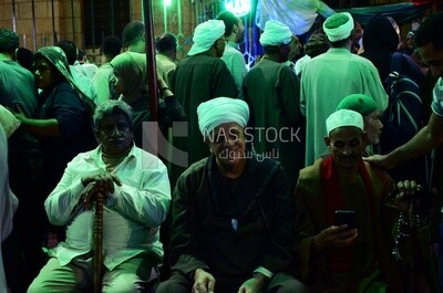 Group of men sitting at Mawlid celebrations, Egypt