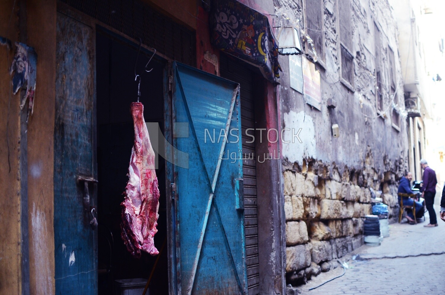 Piece of meat hanging in front of a butcher shop, Egypt