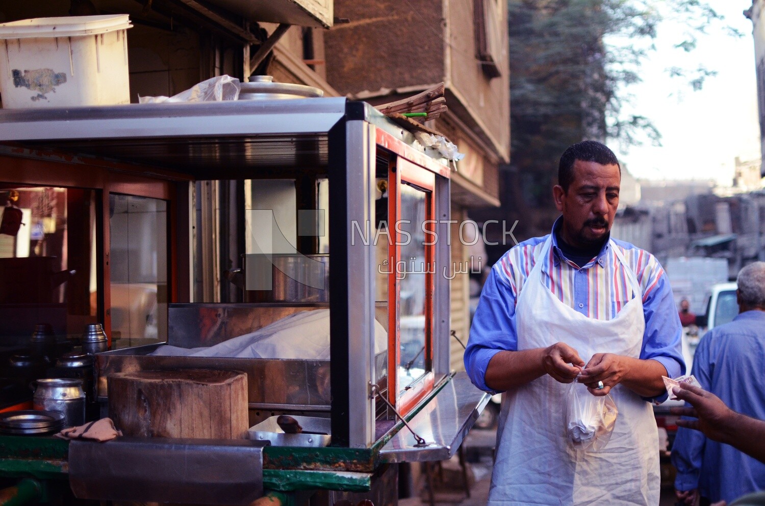 Man owns a street food cart