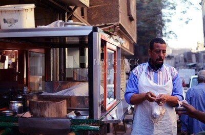 Man owns a street food cart