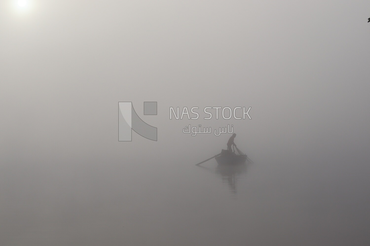 Man on a boat fishing in the middle of the sea during foggy weather, foggy weather