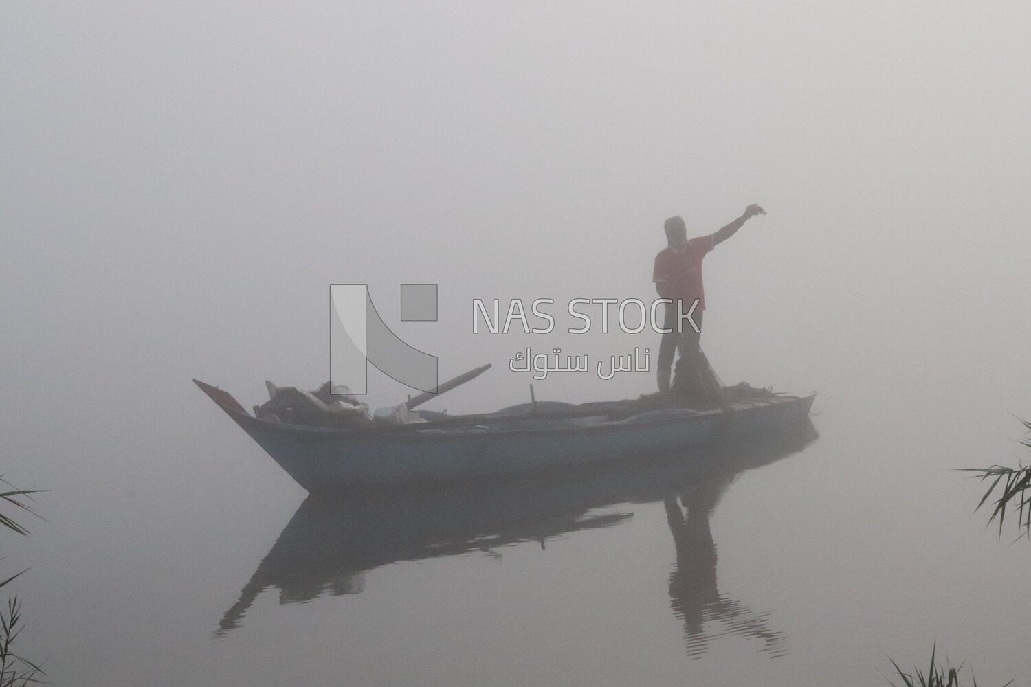 Man on a boat fishing in the middle of the sea during foggy weather, foggy weather