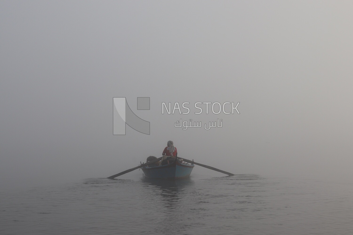 Man on a boat fishing in the middle of the sea during foggy weather, foggy weather