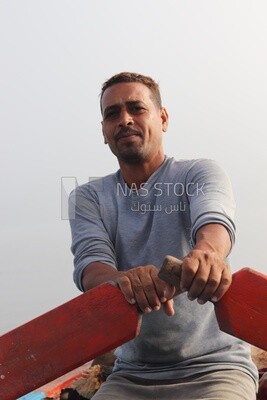 Man on a boat in the middle of the sea during the foggy weather, foggy weather