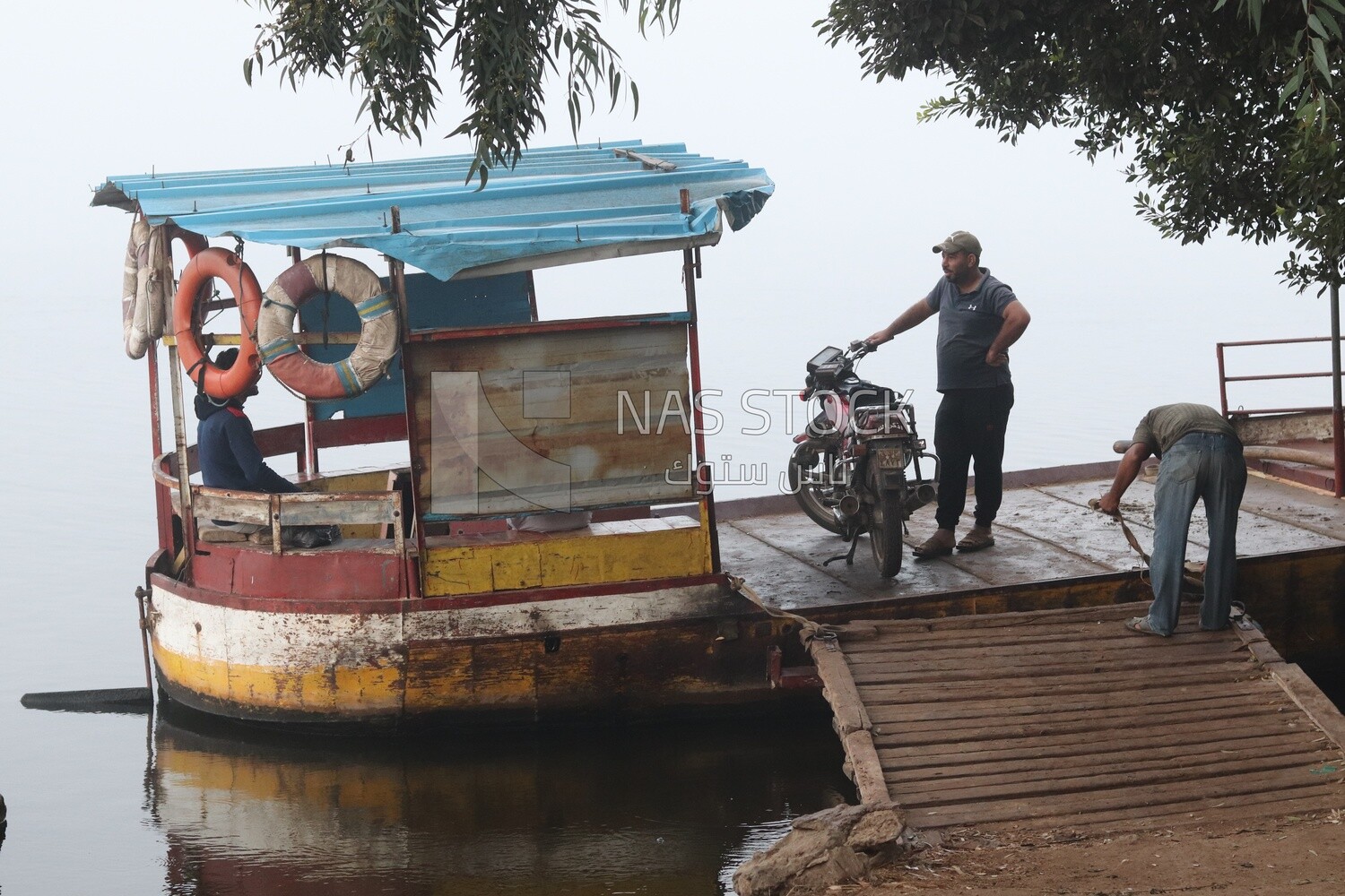 People on the ferry boat on a foggy day, Sea transportation