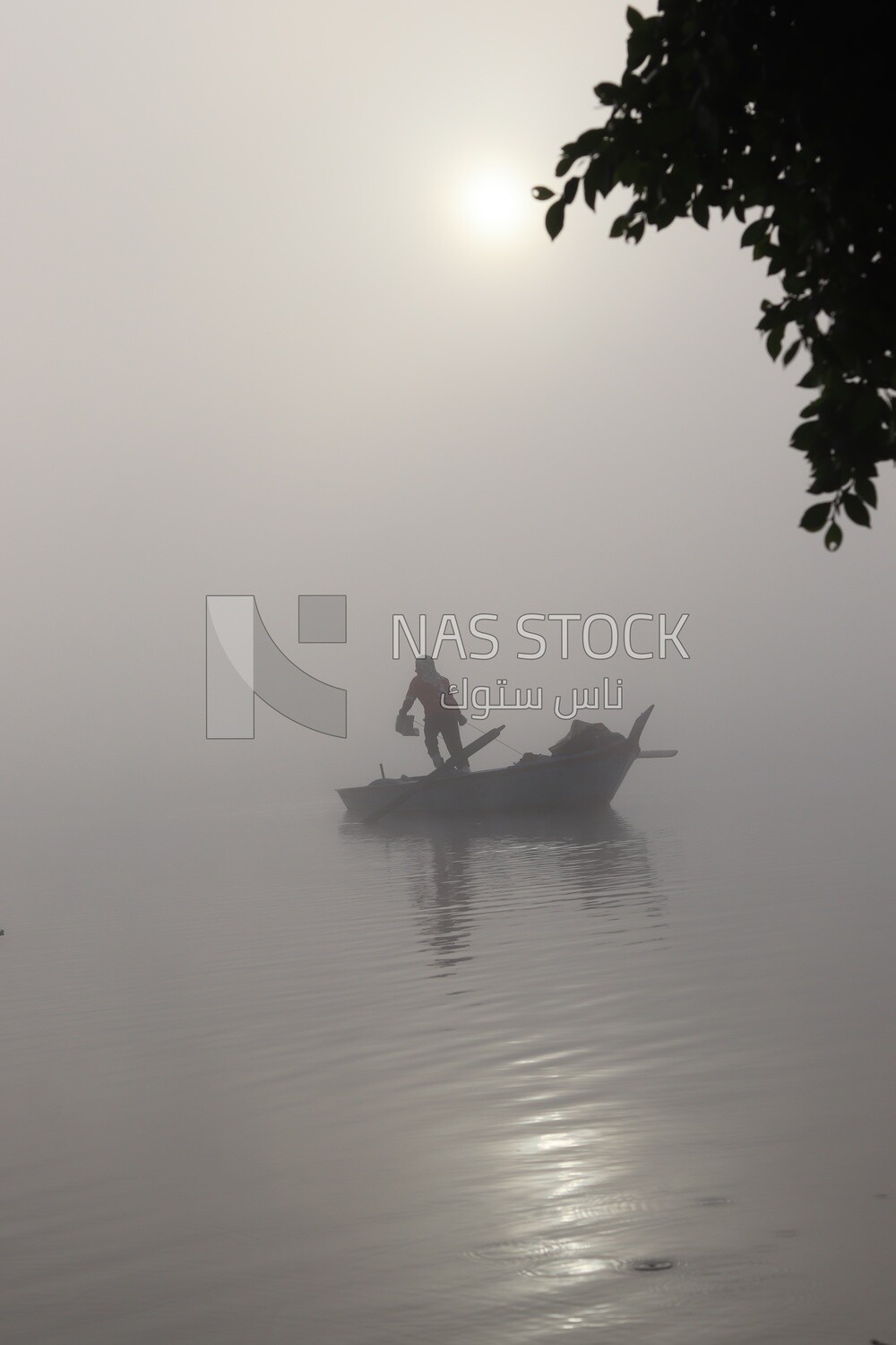 Man on a boat fishing in the middle of the sea during foggy weather, foggy weather