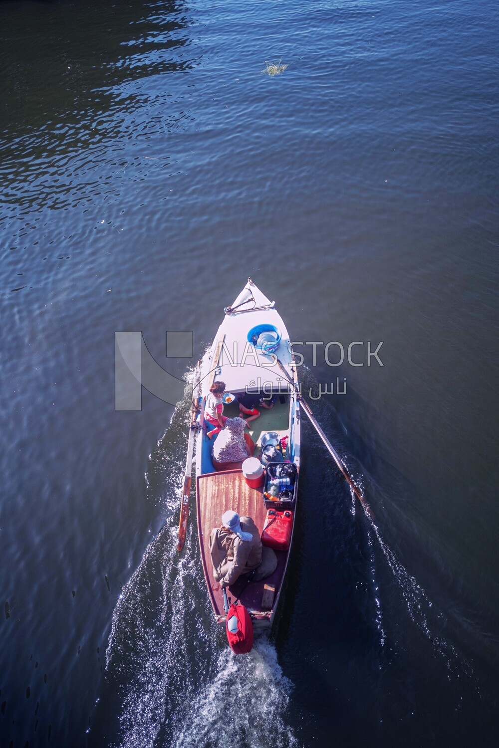 Top view of a boat sailing in the river