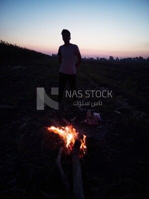 Farmer sitting in a field Shuck the corn, Agricultural land