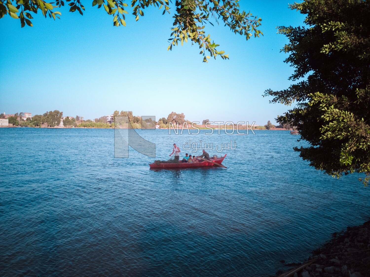 People on the boat in the river