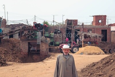 Man standing in front of the brick factory, brick industry
