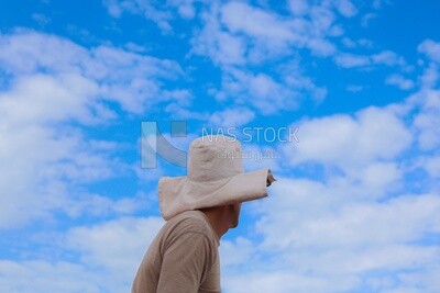 Back view of a man standing in front of the brick factory, brick industry