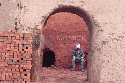 Man sitting in the brick factory, brick industry