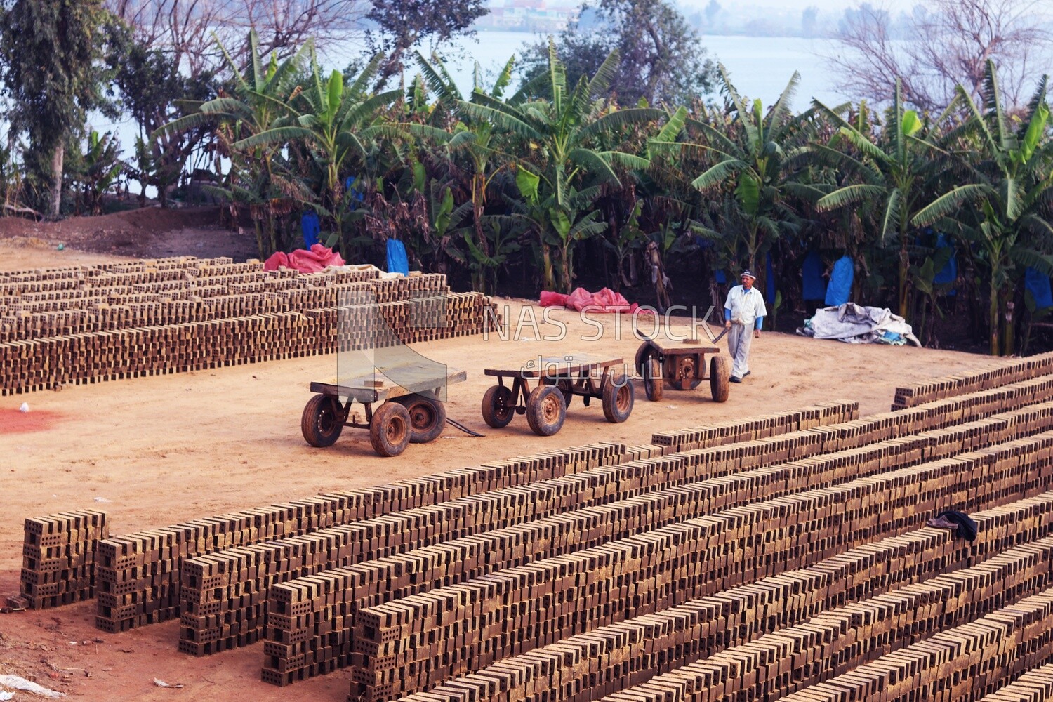 Worker walking in brick factory, brick industry