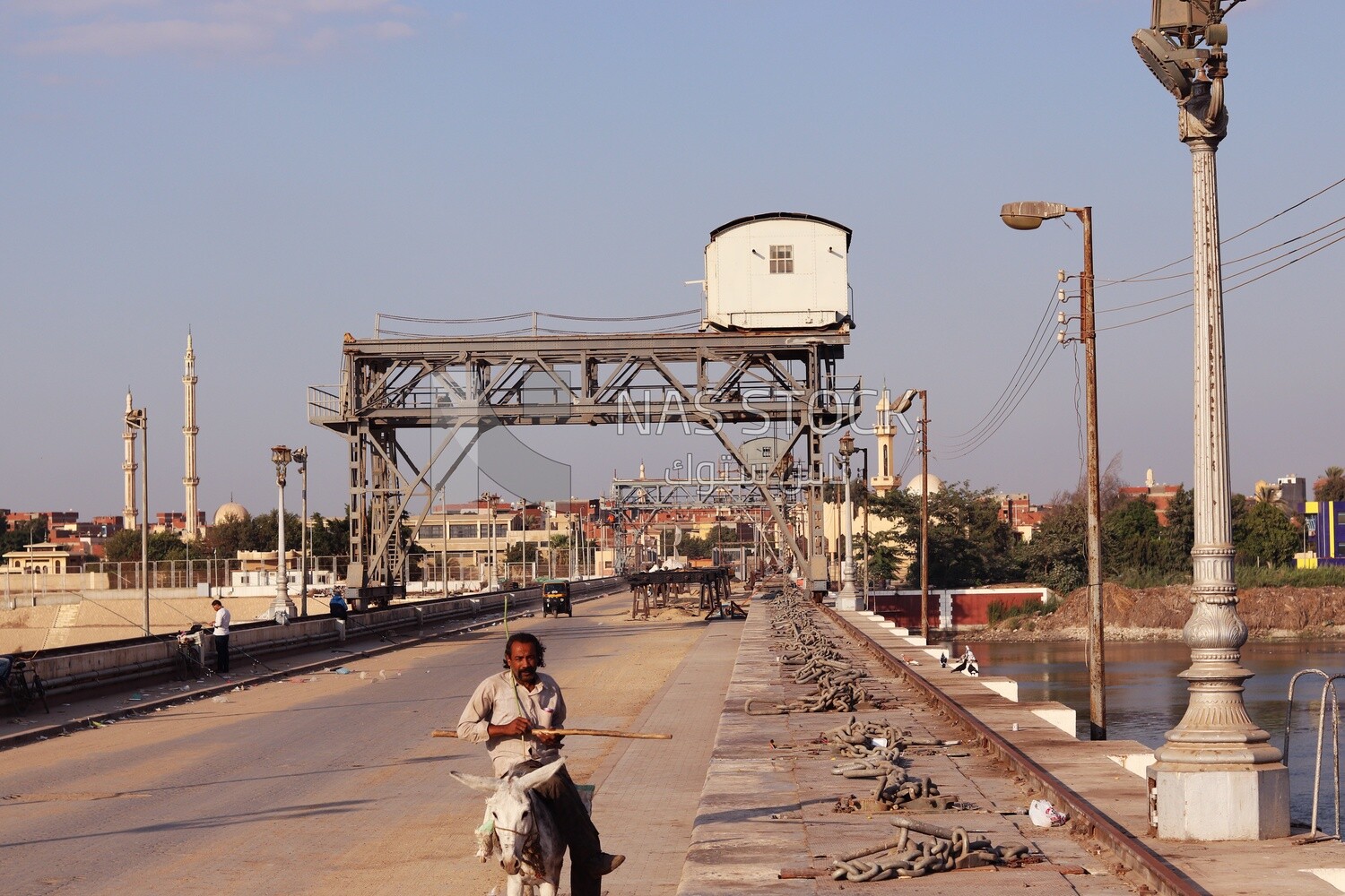 People walking on a bridge in el-gharbia