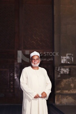 Imam standing in front of the Sultan Hassan mosque, History, Tourism in Egypt