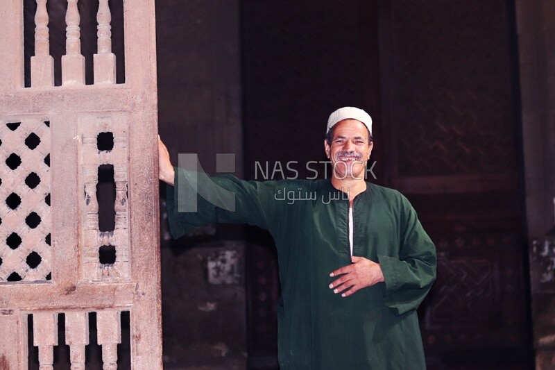 Imam standing in front of the Sultan Hassan mosque, History, Tourism in Egypt