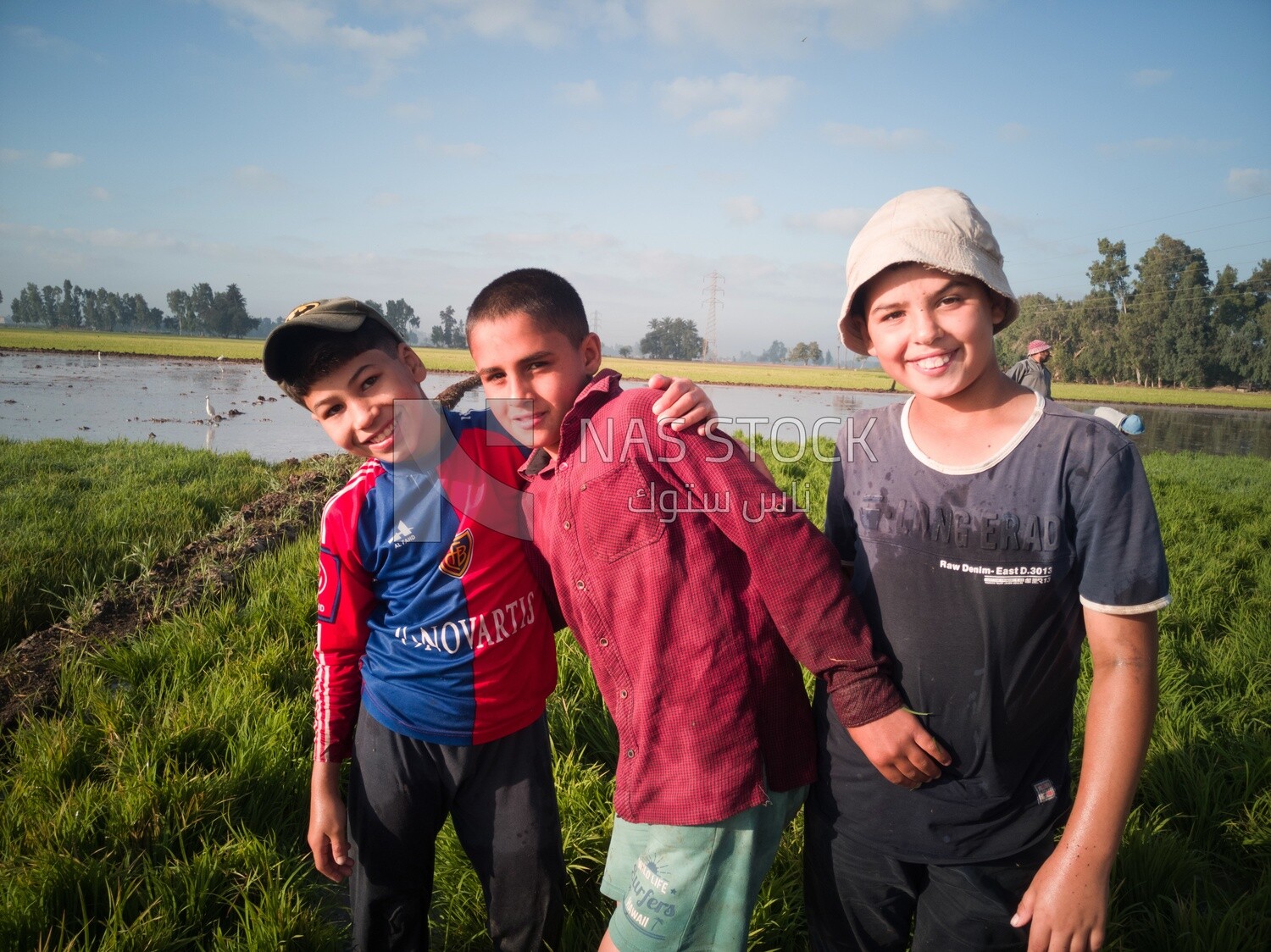 Three boys standing in the field during the plowing of the land, Farm &amp; Agriculture, Cedar Nurseries