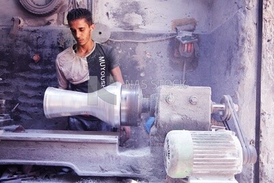 Man making an aluminum Drum in a workshop, the workshop services, music