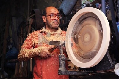 Carpenter wood sanding in a workshop, Professions &amp; Crafts