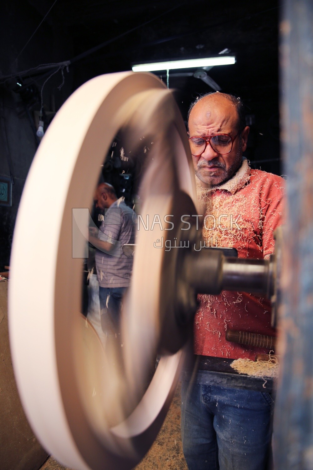Carpenter wood sanding in a workshop, Professions &amp; Crafts