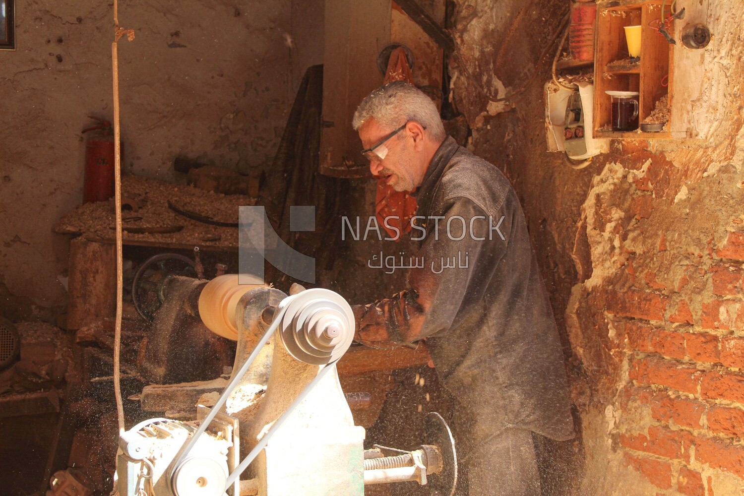 Man working with wood products on the machine, Professions &amp; Crafts