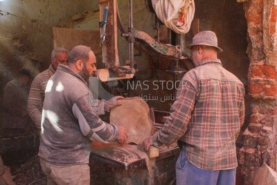Group of men working in a wooden workshop, Discussion, Professions &amp; Crafts