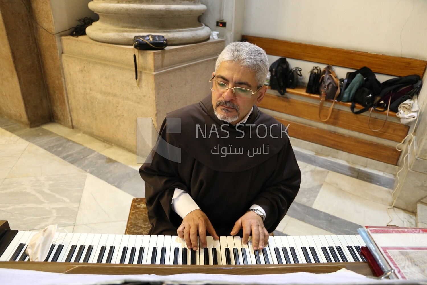 Pianist plays a hymn inside the church