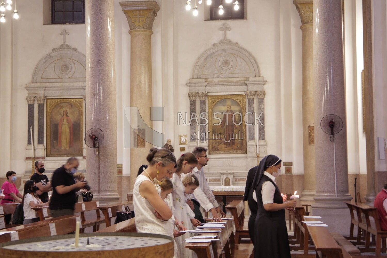 Group of people praying in church
