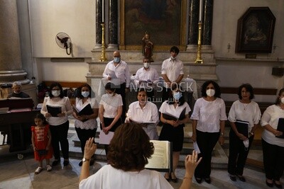 Group of women singing hymns in church