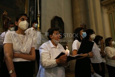 Group of people singing hymns in church